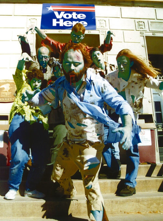 Zombies, seen here attacking a photographer, are believed to have caused voters to shy away from polling places.